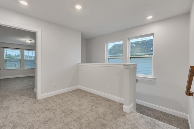 empty room with light colored carpet