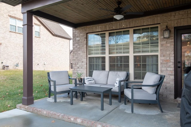 view of patio with an outdoor living space and ceiling fan