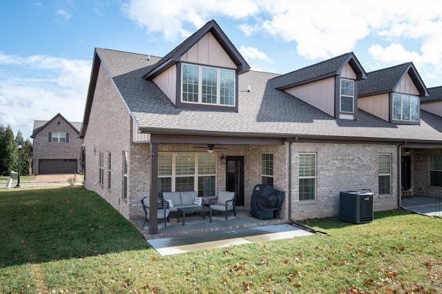 rear view of house featuring an outdoor hangout area, central AC, a yard, and a patio area