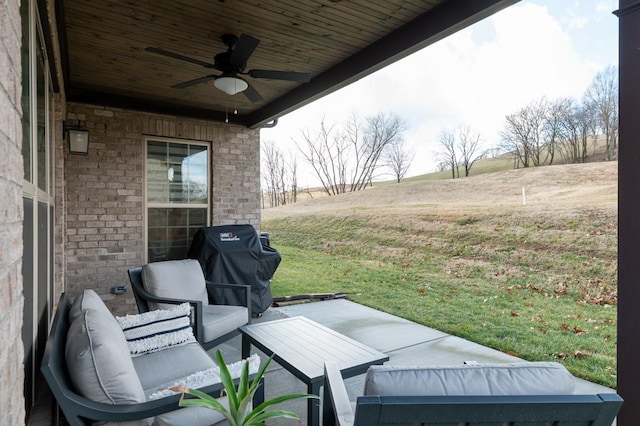 view of patio / terrace featuring grilling area, outdoor lounge area, a rural view, and ceiling fan