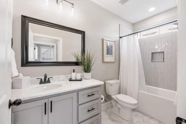 full bathroom featuring vanity, shower / tub combo, and toilet