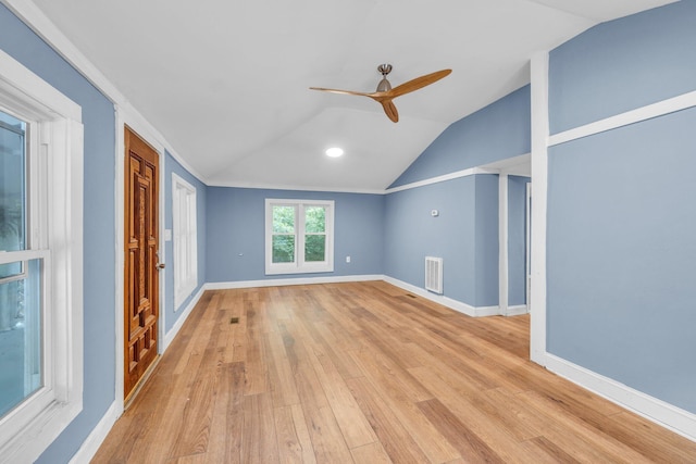 unfurnished living room with ceiling fan, lofted ceiling, and light hardwood / wood-style flooring