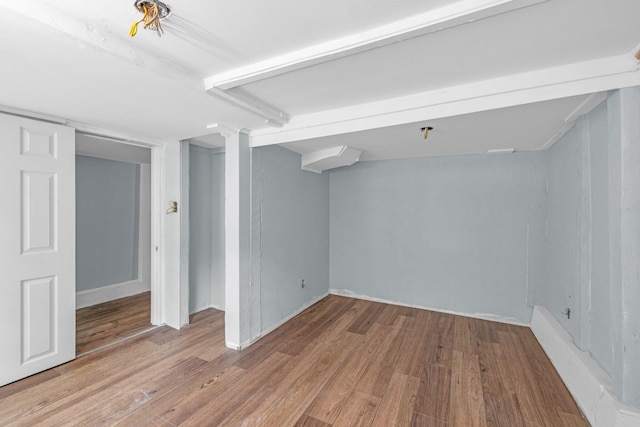 basement with hardwood / wood-style flooring