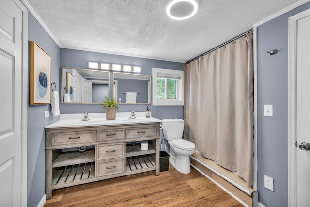 bathroom featuring vanity, wood-type flooring, a textured ceiling, curtained shower, and toilet