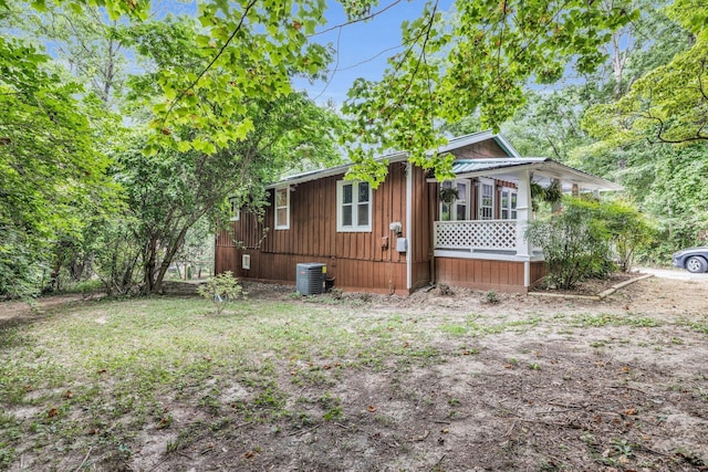 exterior space with a porch and central AC unit