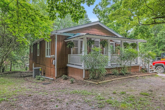 view of side of property with central AC