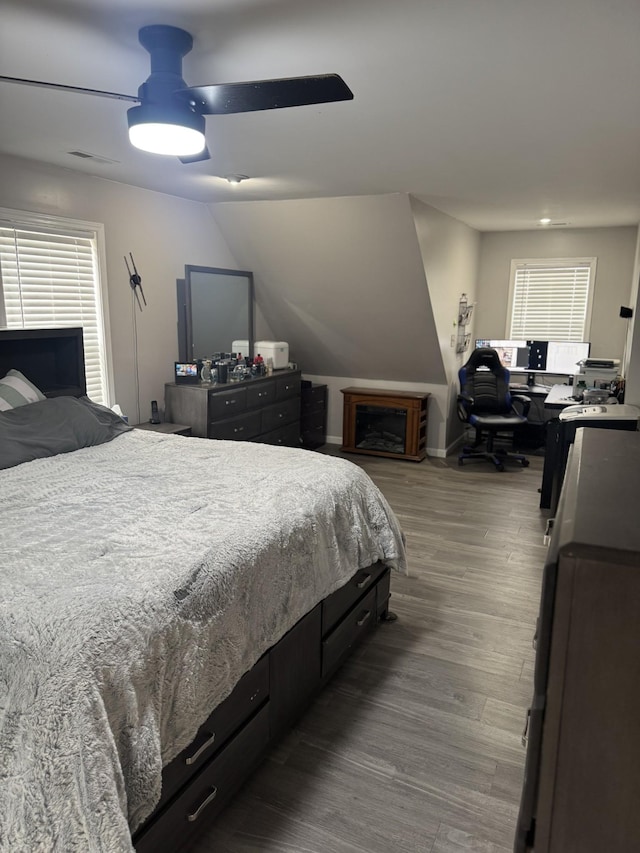 bedroom with wood-type flooring and ceiling fan