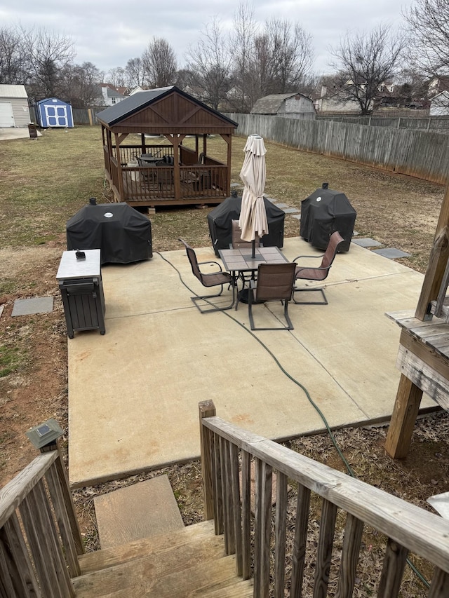 view of patio / terrace featuring area for grilling, a gazebo, and a storage unit