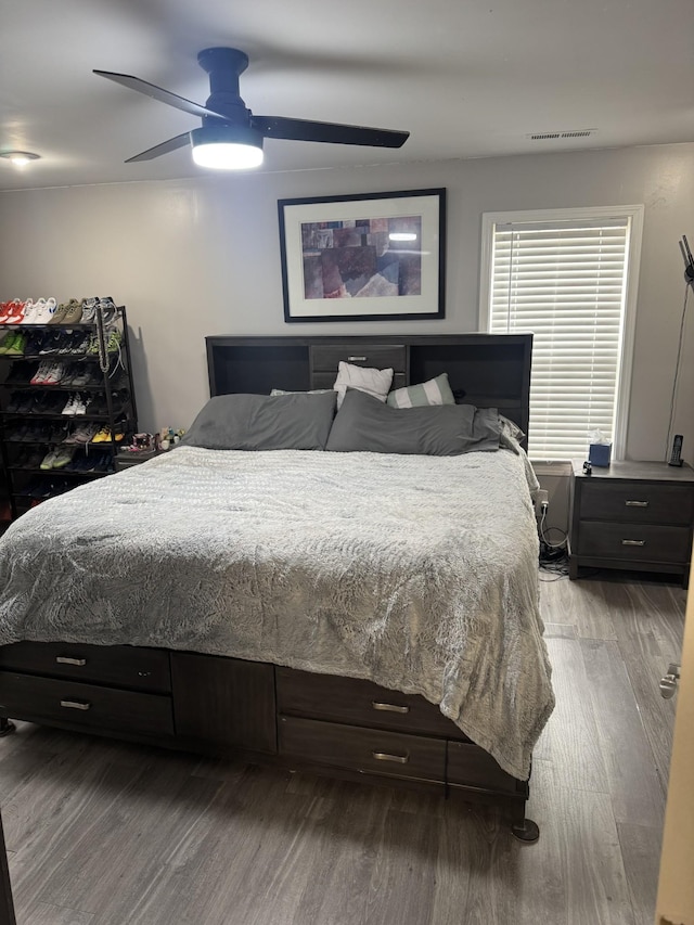 bedroom featuring ceiling fan and wood-type flooring