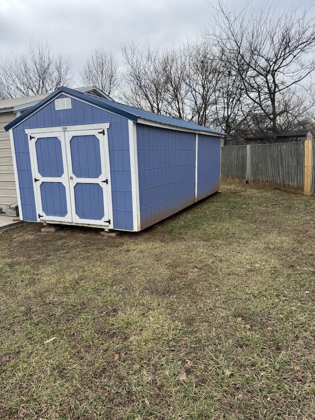 view of outdoor structure with a lawn