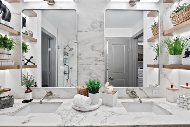 bathroom featuring vanity and an enclosed shower