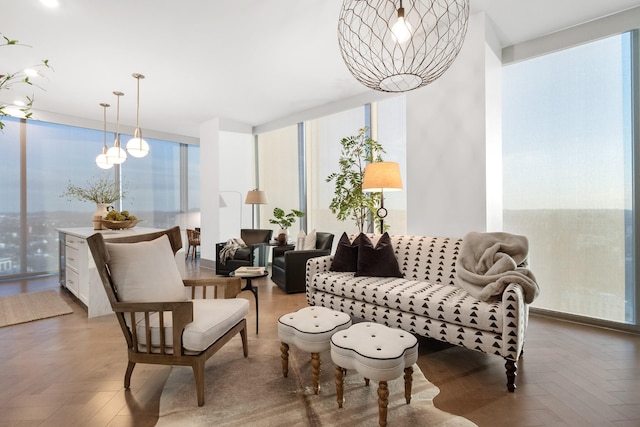 sitting room featuring floor to ceiling windows and parquet flooring