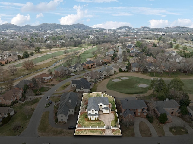 birds eye view of property with a mountain view