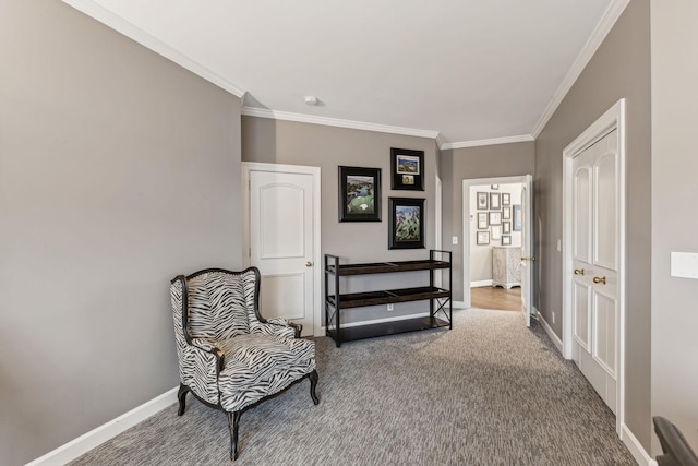 sitting room with crown molding and carpet