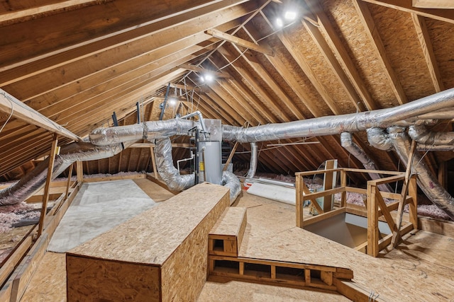 unfinished attic featuring water heater