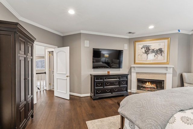 bedroom with crown molding and dark hardwood / wood-style flooring