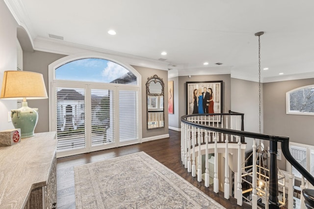 corridor featuring ornamental molding and dark hardwood / wood-style floors