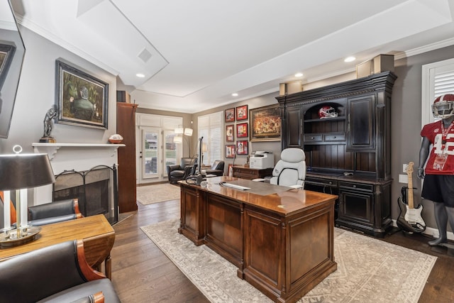 office space featuring hardwood / wood-style flooring and crown molding