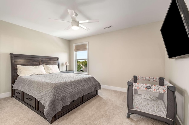 carpeted bedroom with ceiling fan