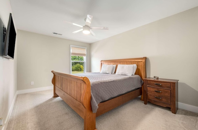 bedroom featuring light carpet and ceiling fan