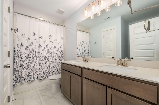 full bathroom featuring vanity, toilet, and shower / tub combo