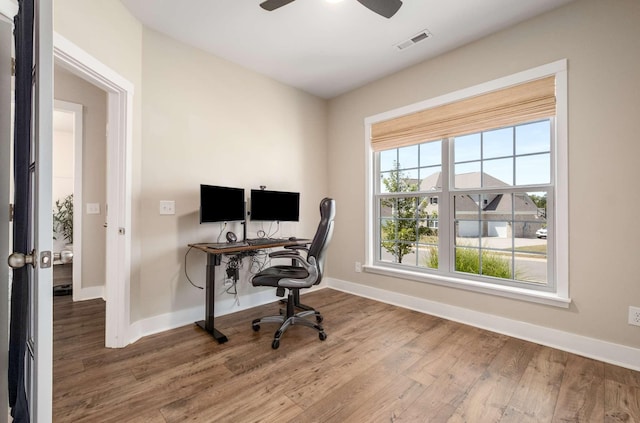 office space featuring hardwood / wood-style flooring and ceiling fan