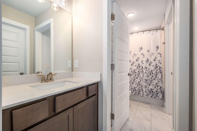 bathroom featuring vanity and walk in shower