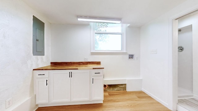 bathroom featuring vanity, electric panel, and hardwood / wood-style floors