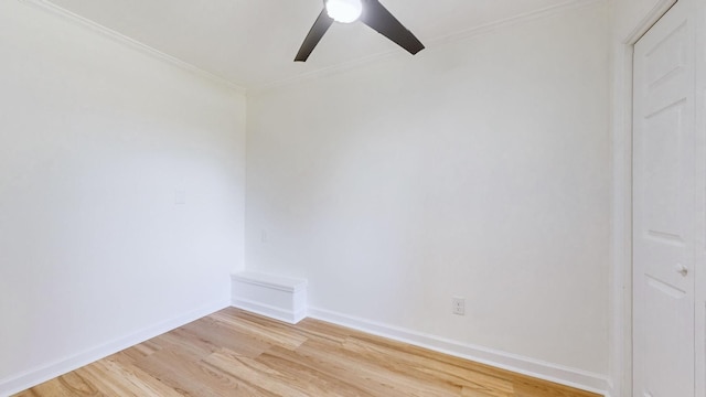 unfurnished room with ornamental molding, ceiling fan, and light wood-type flooring