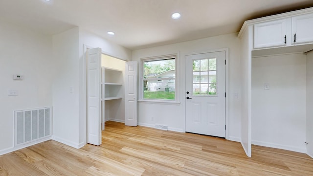 doorway with light hardwood / wood-style flooring