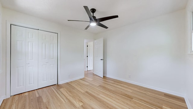 unfurnished bedroom with a closet, ceiling fan, and light wood-type flooring