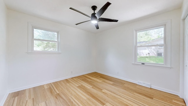 empty room featuring ceiling fan and light wood-type flooring