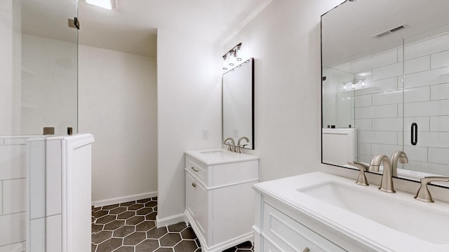 bathroom with vanity, tile patterned floors, and a shower with shower door