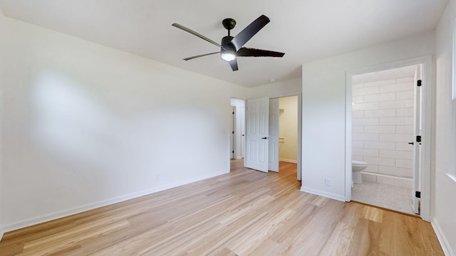 unfurnished bedroom with light hardwood / wood-style floors, a closet, ceiling fan, and ensuite bathroom