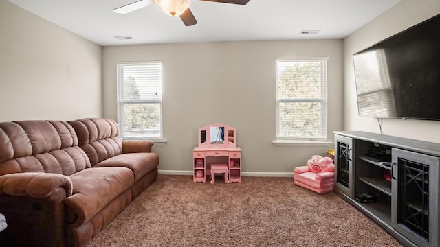 rec room featuring carpet and ceiling fan