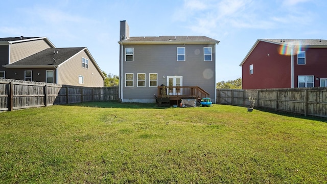 back of house with a yard