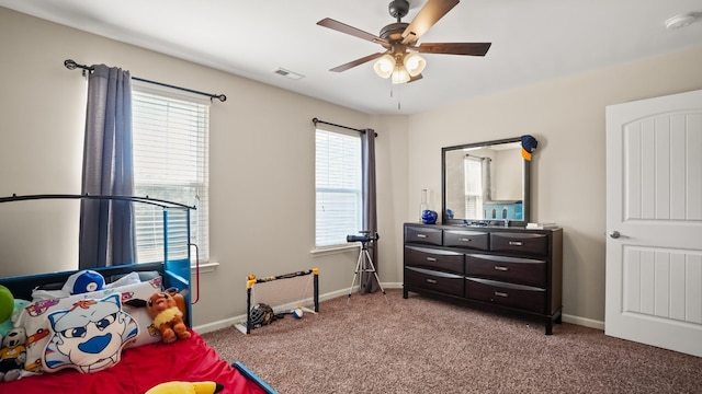 carpeted bedroom with ceiling fan