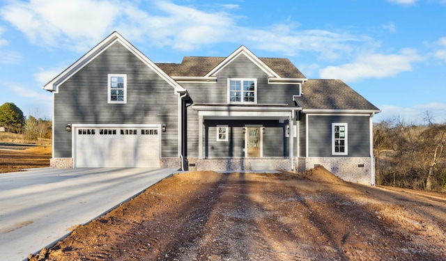 view of front of house with an attached garage and driveway