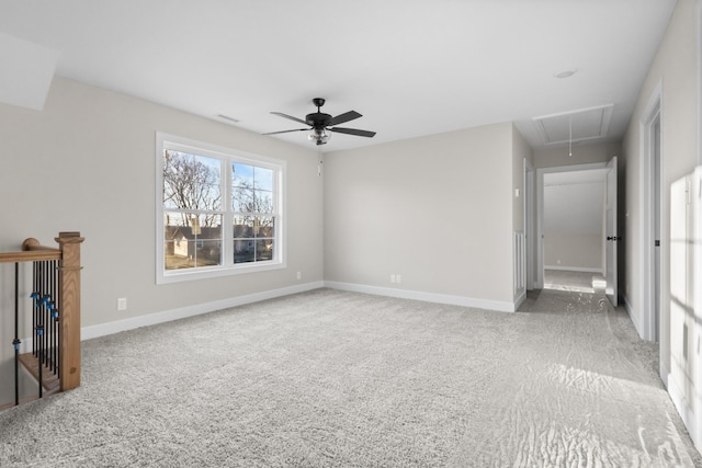 interior space featuring attic access, carpet, and baseboards