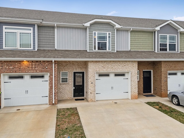 multi unit property featuring a garage