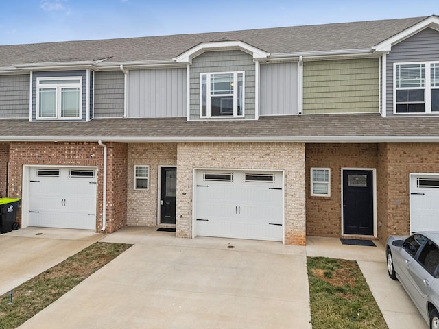 multi unit property featuring a garage