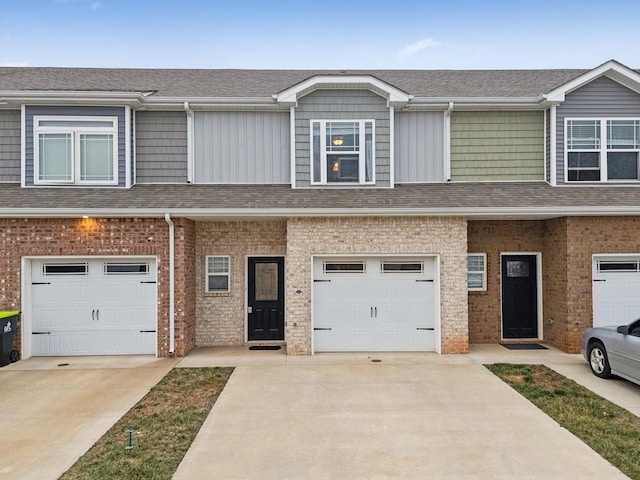 townhome / multi-family property featuring a garage