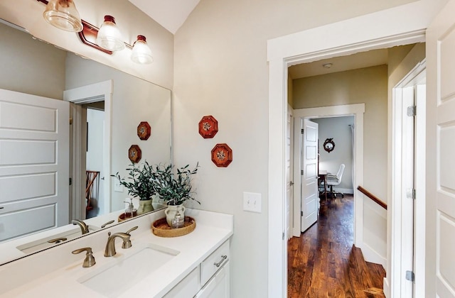 bathroom with hardwood / wood-style flooring and vanity