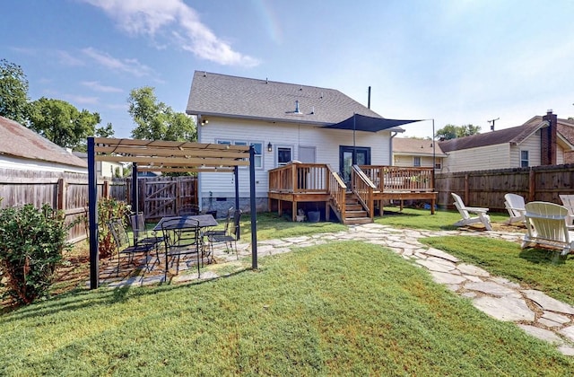 rear view of house with a pergola, a yard, and a deck