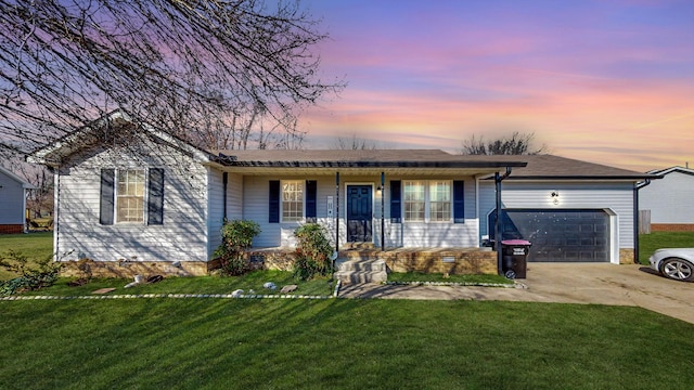 ranch-style home with a porch, a garage, and a yard