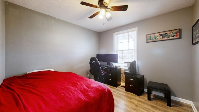 bedroom featuring ceiling fan and light wood-type flooring