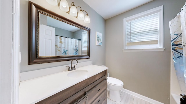 bathroom with vanity and toilet