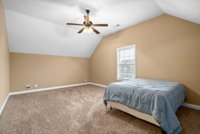 bedroom with vaulted ceiling, ceiling fan, and carpet