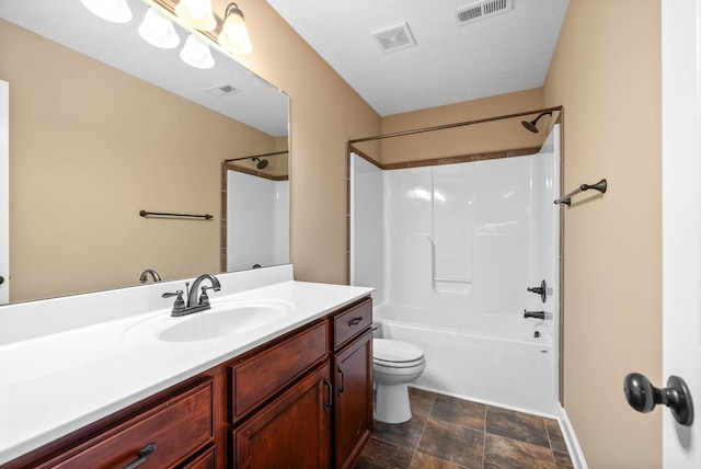 full bathroom with  shower combination, vanity, and toilet