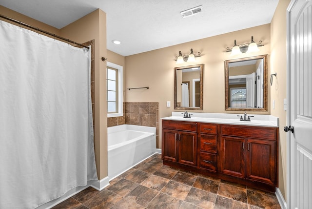 bathroom featuring vanity and a bathtub